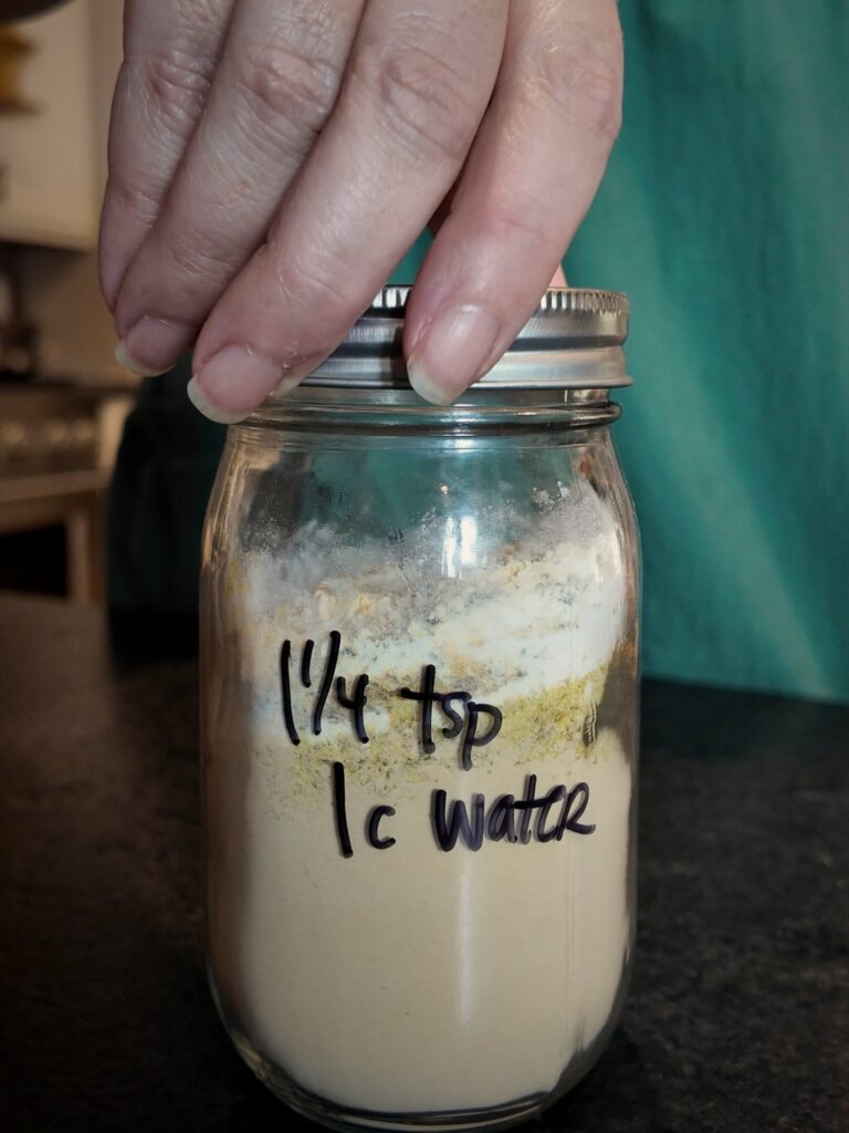 Jar of chicken bouillon powder labeled 1 1/4 tsp to 1 c water